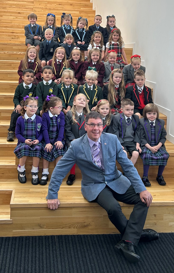 Depute provost of Inverclyde, Graeme Brooks, with twins who are starting primary one.